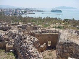 ancient ruins of Aegina and temple of Apollo with Aegina town in the background